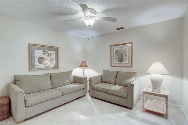 a living room with furniture a bed and a couch