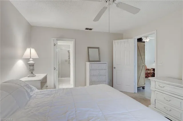 a bedroom with a bed and a cabinets