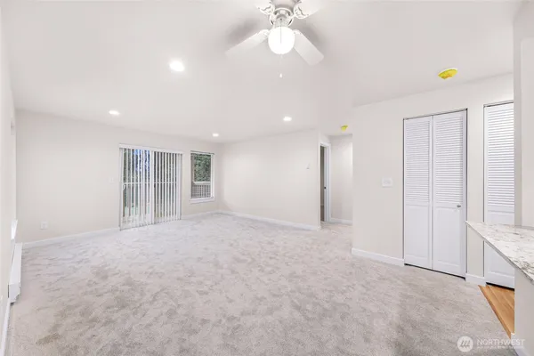 a view of an empty room with a window