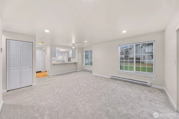 a view of an empty room with a window