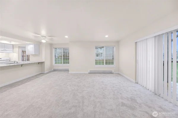 a view of an empty room with a window