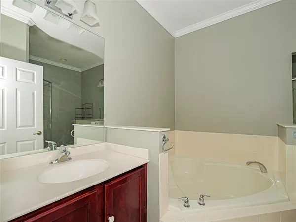 a bathroom with a bathtub and a sink