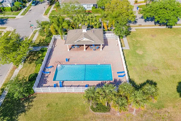 an aerial view of a house with a garden and swimming pool