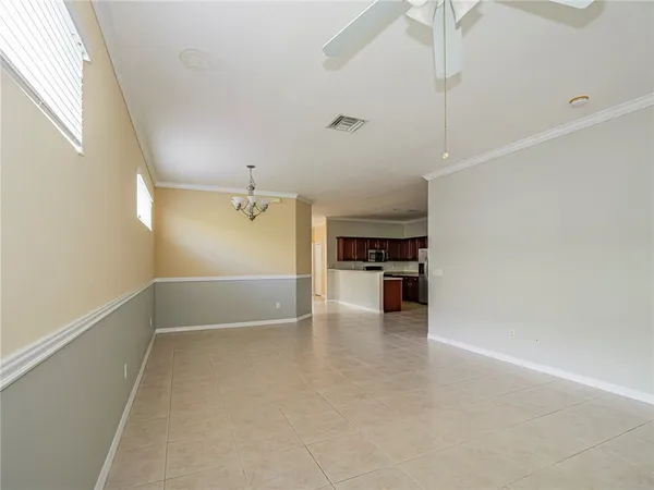 a view of a kitchen with a sink and dishwasher and wooden floor