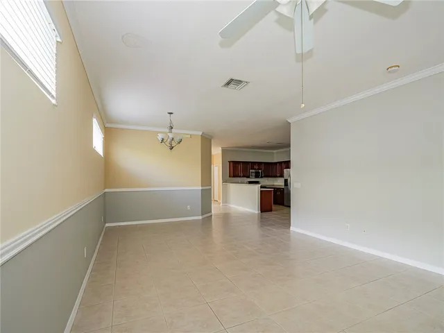 a view of a kitchen with a sink and dishwasher and wooden floor