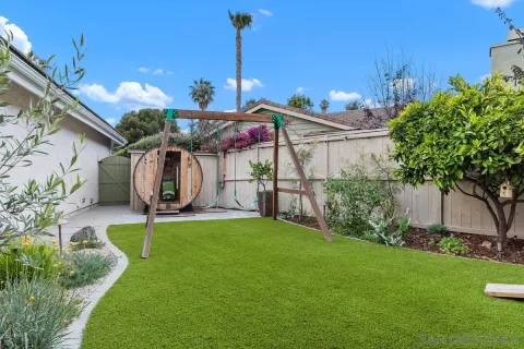 a view of a patio with table and chairs potted plants