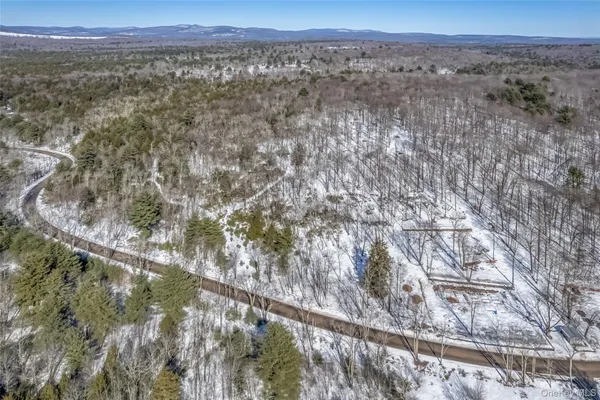 a view of a mountain with mountains