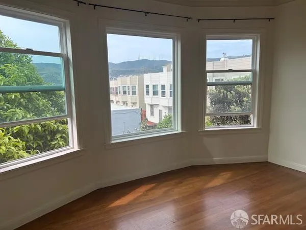 a view of an empty room with a window