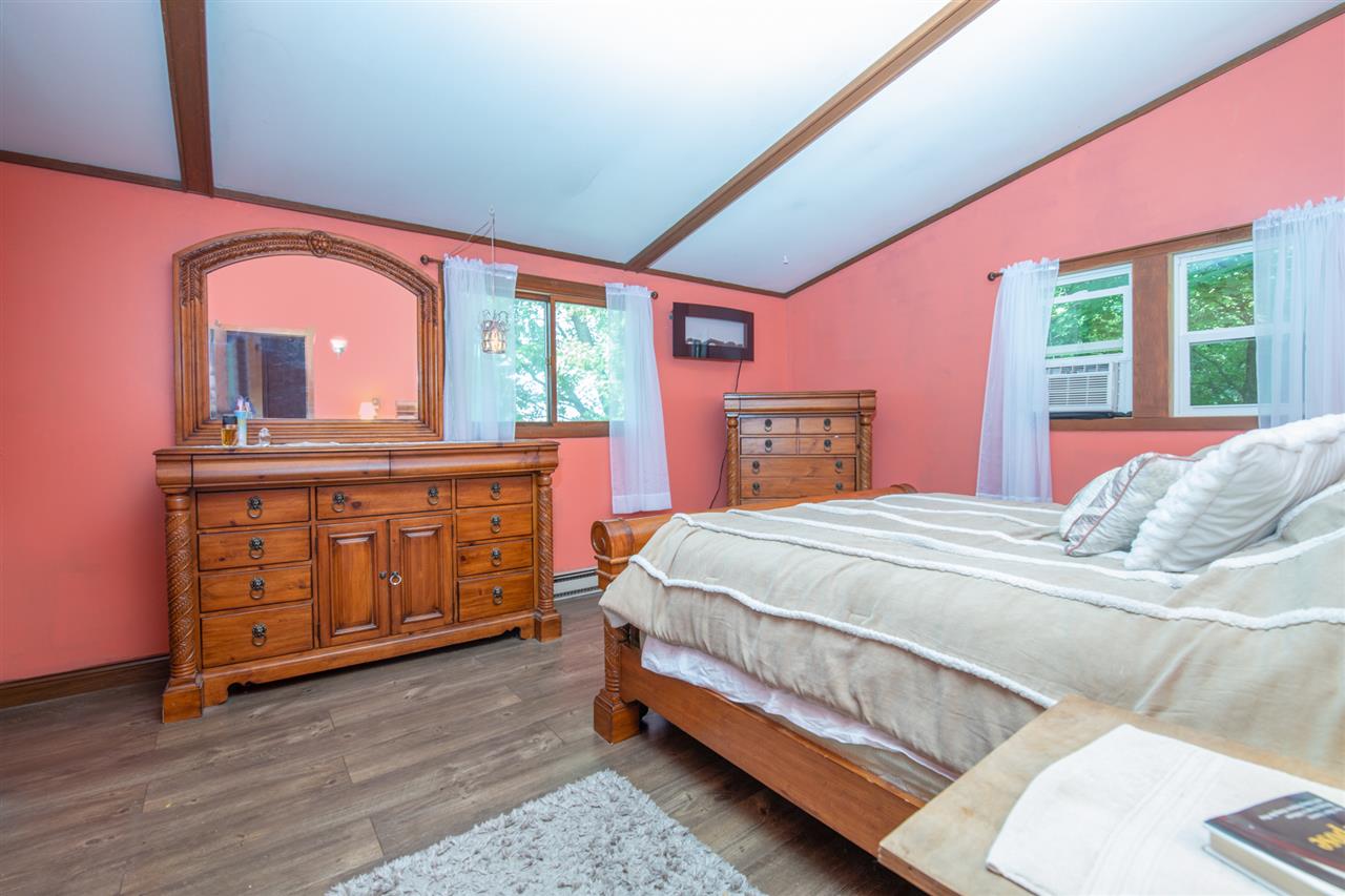 18450 East State Line Road Davis, IL 61019 - Photo 16 of 26 a bedroom with a bed and a dresser
