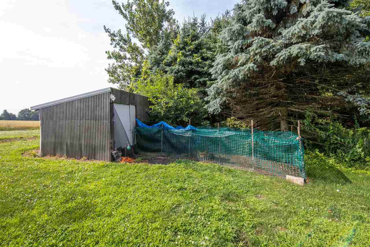 18450 East State Line Road Davis, IL 61019 - Photo 23 of 26 a backyard of a house with lots of green space