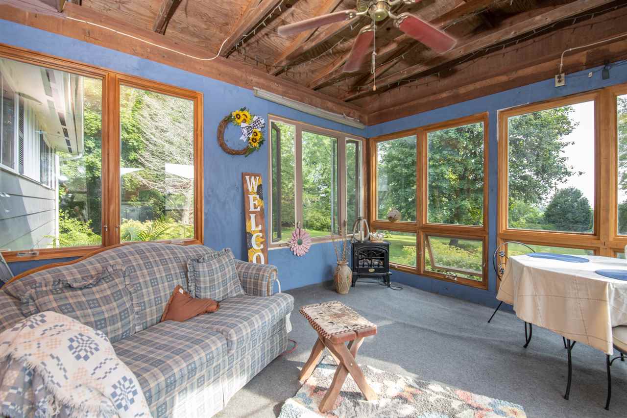 18450 East State Line Road Davis, IL 61019 - Photo 5 of 26 a living room with furniture and a large window