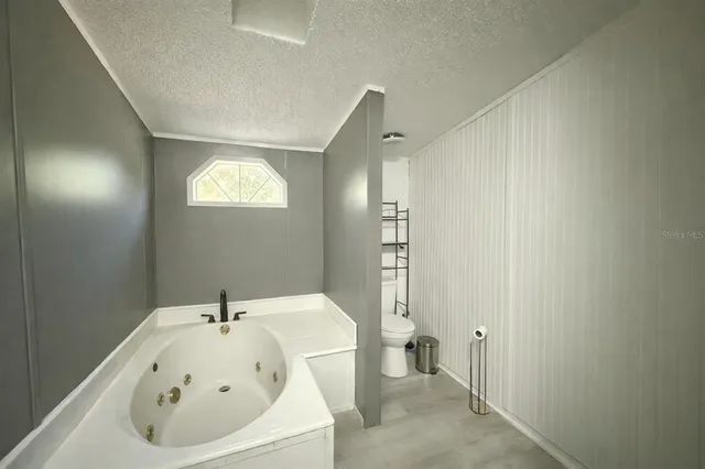 a bathroom with a shower and a mirror
