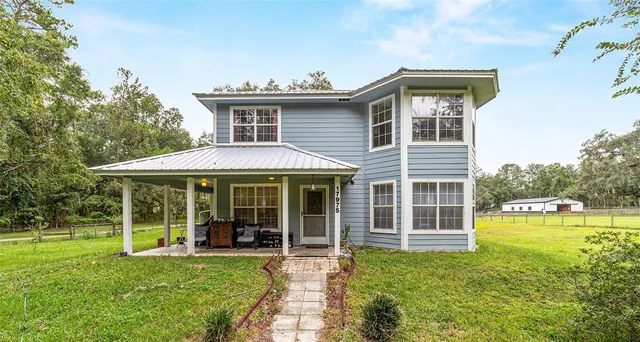 front view of a house with a yard
