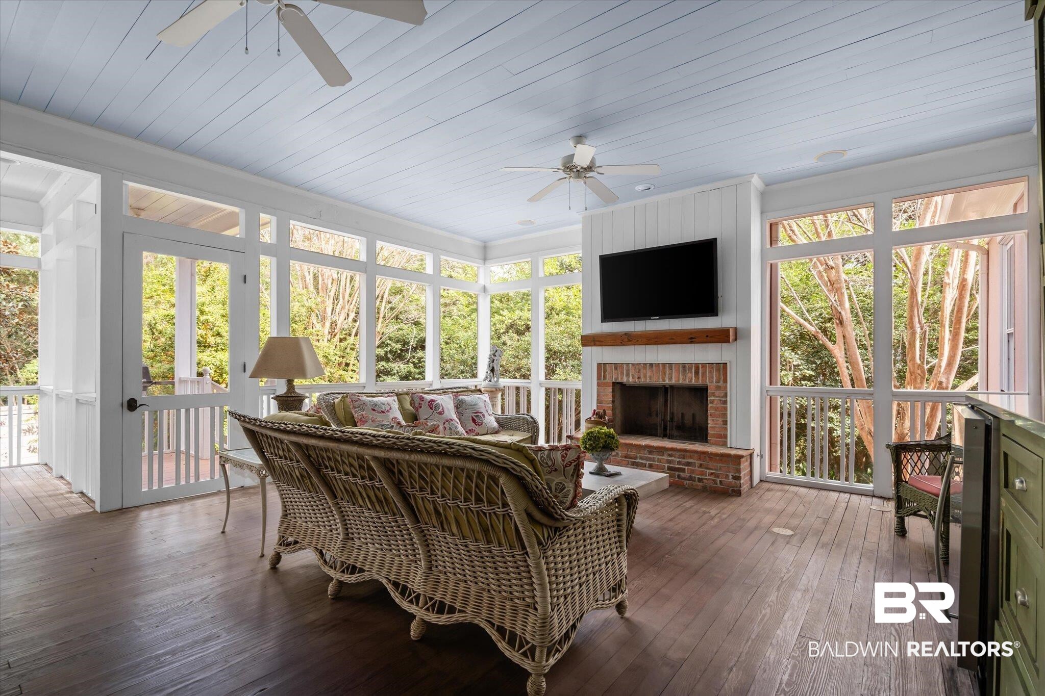 354 Dogwood Lane Mobile, AL 36608 - Photo 29 of 44 Sunroom / solarium with ceiling fan and a brick fireplace