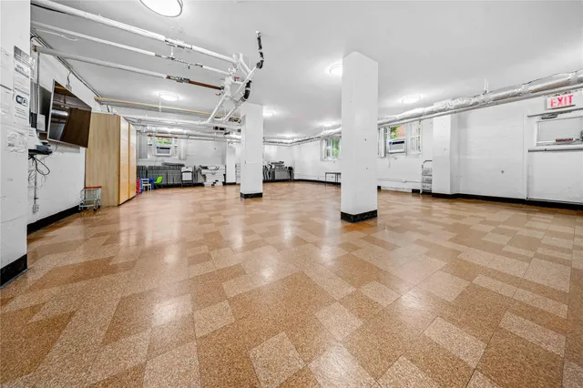 a view of a livingroom with gym equipment