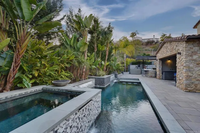 a view of a swimming pool with a patio