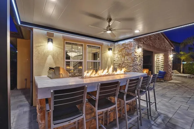 a dining room with a wooden table and chairs