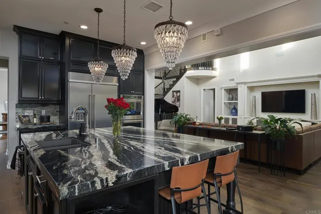 a kitchen with a table chairs and a stove