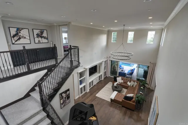 a view of entryway livingroom and hall with wooden floor