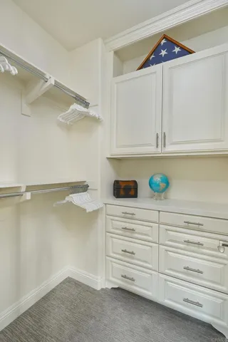 a view of an empty walk in closet