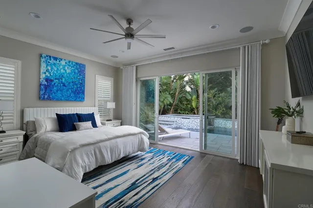 a bedroom with a large bed and a large window