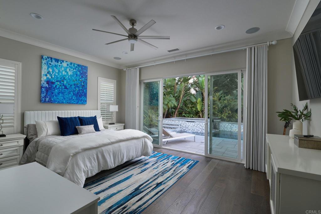 3615 Corte Claro Carlsbad, CA 92009 - Photo 38 of 49 a bedroom with a large bed and a large window