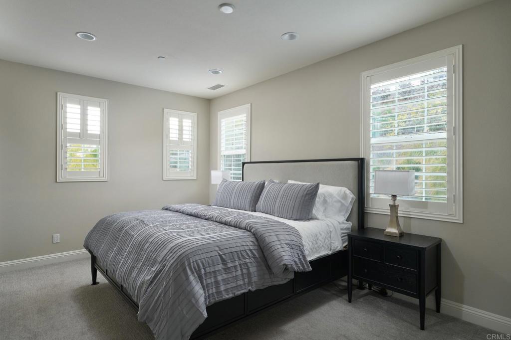 3615 Corte Claro Carlsbad, CA 92009 - Photo 40 of 49 a bed sitting in a bedroom next to a window