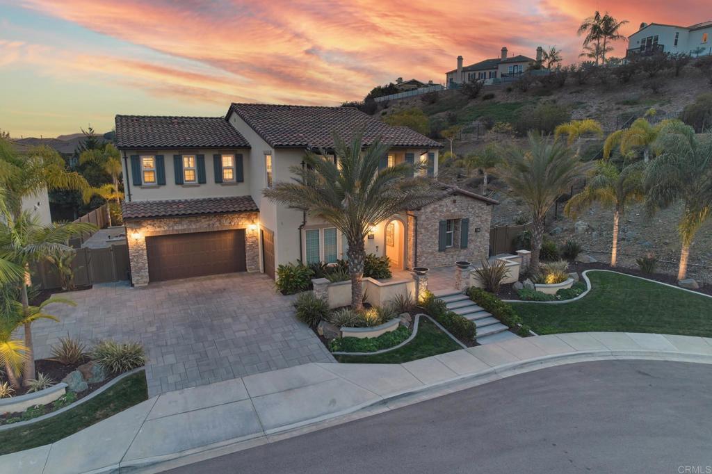 3615 Corte Claro Carlsbad, CA 92009 - Photo 4 of 49 a front view of a house with garden and patio