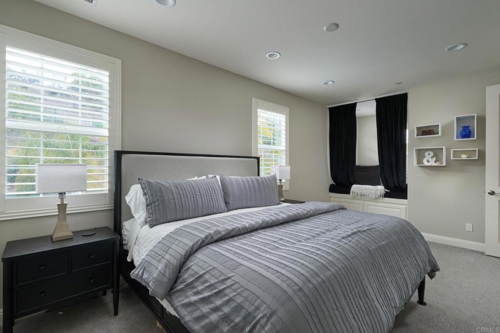 3615 Corte Claro Carlsbad, CA 92009 - Photo 41 of 49 a bedroom with a bed and a lamp
