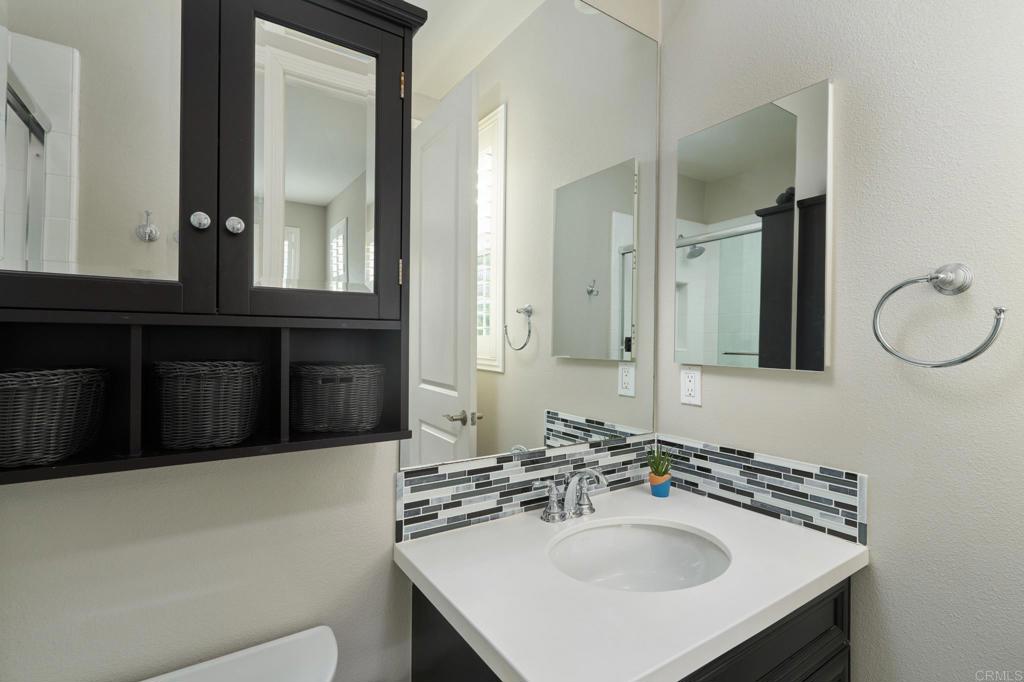 3615 Corte Claro Carlsbad, CA 92009 - Photo 42 of 49 a bathroom with a sink and a mirror
