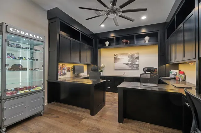 a kitchen with stainless steel appliances kitchen island granite countertop a sink stove and cabinets