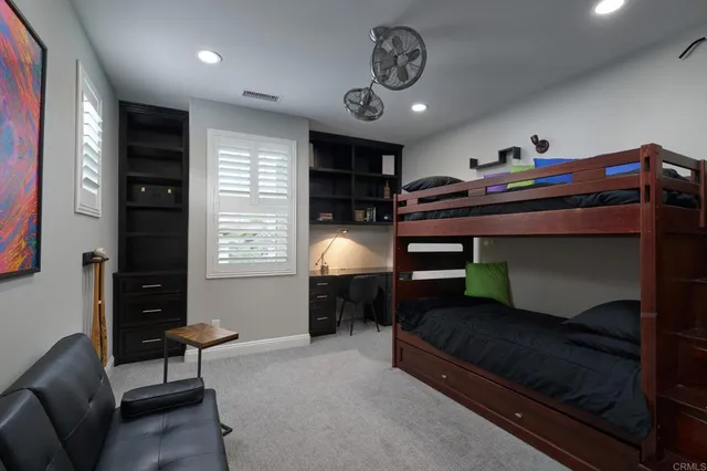 a bedroom with furniture and a chandelier