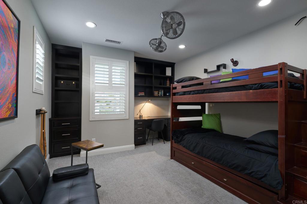 3615 Corte Claro Carlsbad, CA 92009 - Photo 47 of 49 a bedroom with furniture and a chandelier