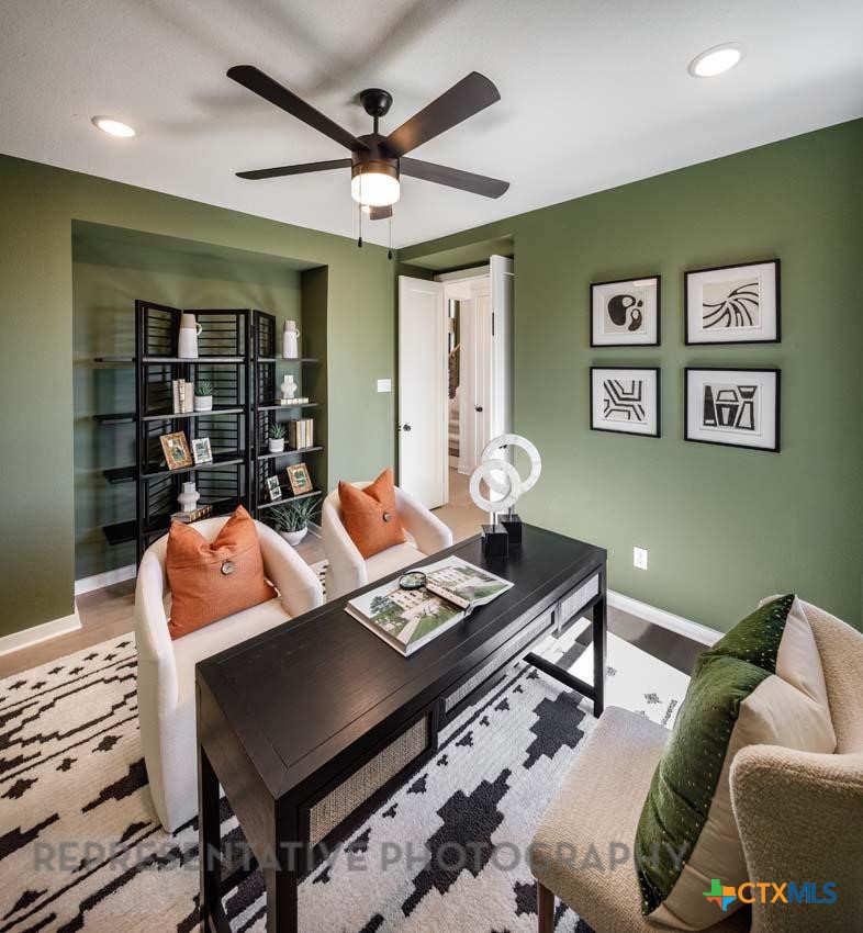 133 Three Oaks Lane Georgetown, TX 78628 - Photo 20 of 40 a living room with furniture and window