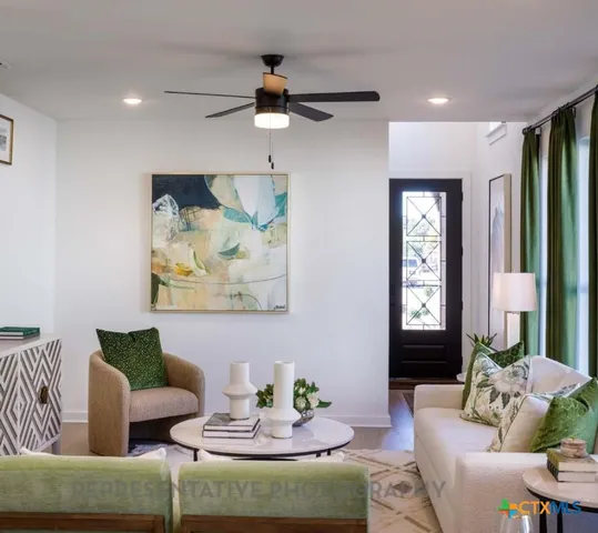 a living room with furniture and a large window