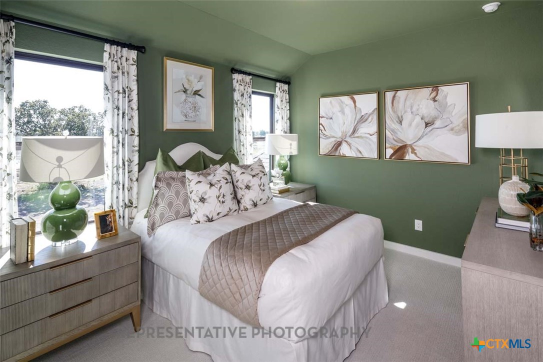 133 Three Oaks Lane Georgetown, TX 78628 - Photo 26 of 40 a bedroom with a bed and a painting on the wall