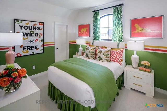 a bedroom with a bed and a dresser in it