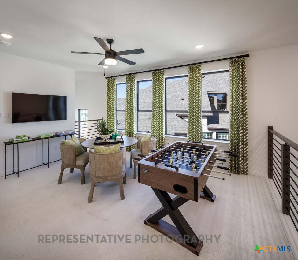 133 Three Oaks Lane Georgetown, TX 78628 - Photo 28 of 40 a living room with furniture and a flat screen tv