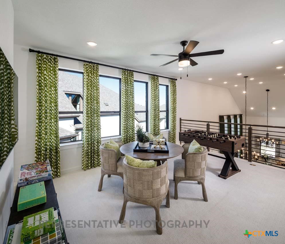 133 Three Oaks Lane Georgetown, TX 78628 - Photo 29 of 40 a living room with furniture and a large window