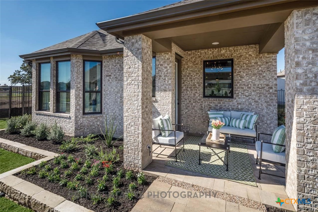 133 Three Oaks Lane Georgetown, TX 78628 - Photo 30 of 40 a front view of a house with garden