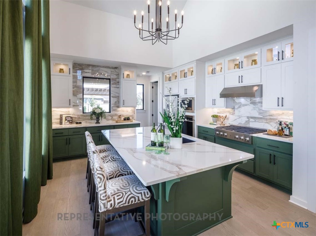 133 Three Oaks Lane Georgetown, TX 78628 - Photo 4 of 40 a kitchen with a dining table and chairs