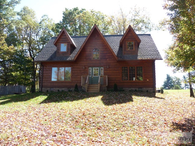 1057 Blue Ridge Church Road Purlear, NC 28665 - Photo 1 of 25 a front view of a house with a yard