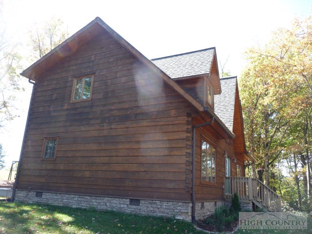 1057 Blue Ridge Church Road Purlear, NC 28665 - Photo 18 of 25 a brick building with a small yard