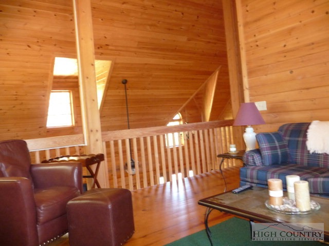 1057 Blue Ridge Church Road Purlear, NC 28665 - Photo 4 of 25 a living room with couches chairs and wooden floor