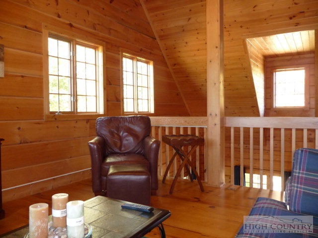 1057 Blue Ridge Church Road Purlear, NC 28665 - Photo 5 of 25 a living room with furniture a rug and a window
