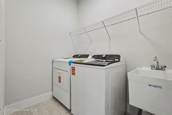 a utility room with dryer and washer