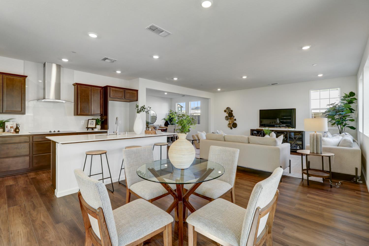 10167 Ramy Circle Elk Grove, CA 95757 - Photo 11 of 50 a view of kitchen with microwave stove refrigerator dining table and chairs