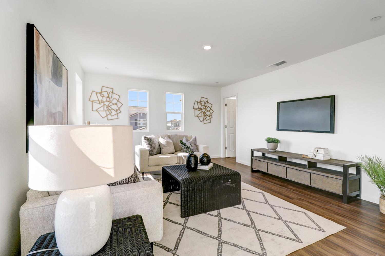 10167 Ramy Circle Elk Grove, CA 95757 - Photo 25 of 50 a living room with furniture and a flat screen tv