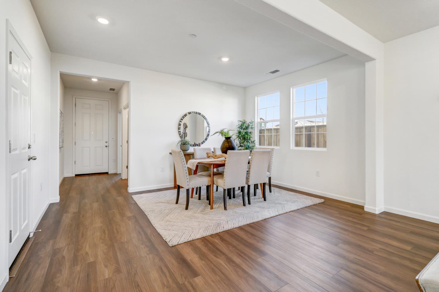 10167 Ramy Circle Elk Grove, CA 95757 - Photo 3 of 50 a view of a dining room with furniture window and wooden floor