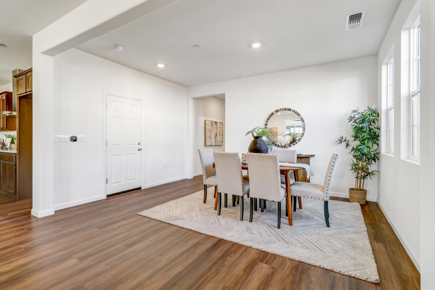 10167 Ramy Circle Elk Grove, CA 95757 - Photo 4 of 50 a view of a dining room with furniture and wooden floor